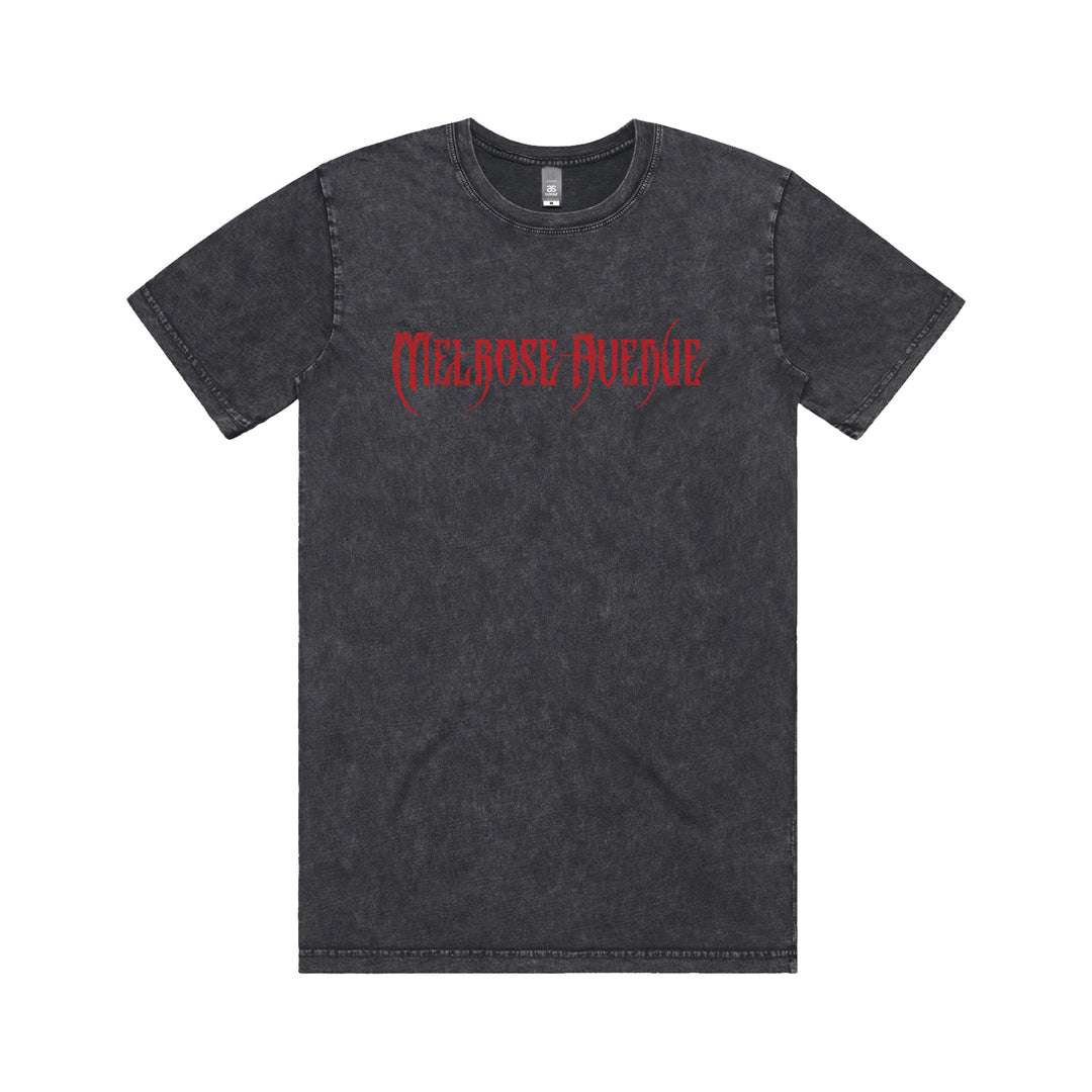 A black acid-wash tee from Melrose Avenue, featuring “Melrose Avenue” in red gothic font across the chest, displayed on a white background.