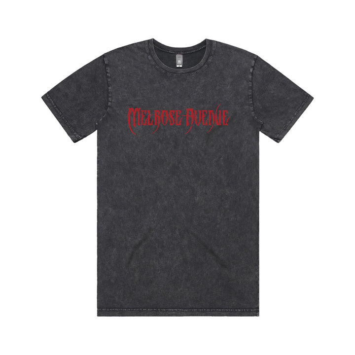 A black acid-wash tee from Melrose Avenue, featuring “Melrose Avenue” in red gothic font across the chest, displayed on a white background.