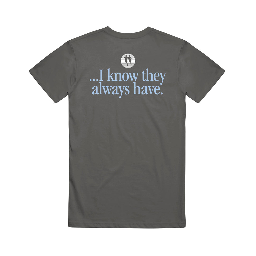 A dark gray cotton t-shirt from Rival Schools features light blue text on the back: "...I know they always have." Above it is a small white graphic of two trees in a circle, making this stylish printed tee comfortable to wear.