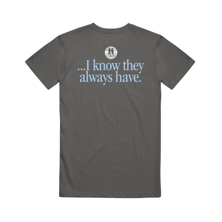 A dark gray cotton t-shirt from Rival Schools features light blue text on the back: "...I know they always have." Above it is a small white graphic of two trees in a circle, making this stylish printed tee comfortable to wear.
