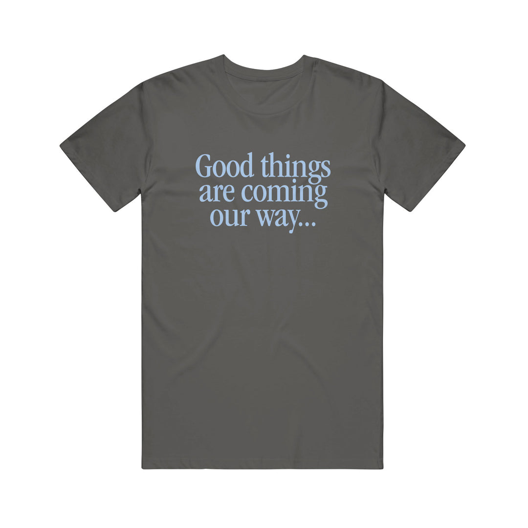 A dark gray Rival Schools cotton T-shirt featuring "Good things are coming our way..." printed in light blue text on the front.