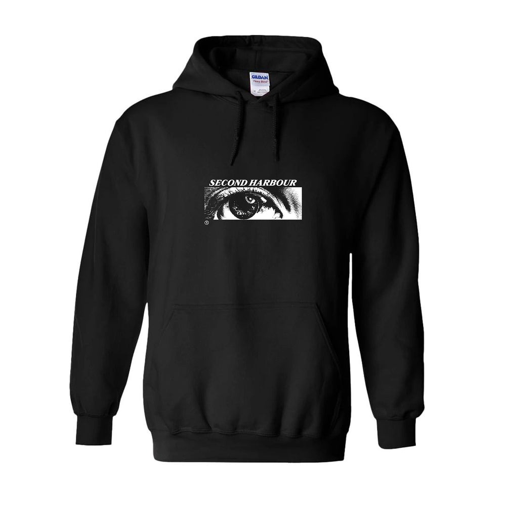 Black pullover hoodie by Second Harbour with a white rectangular eye graphic and "SECOND HARBOUR" on the chest, plus front pocket and drawstring hood for classic style.
