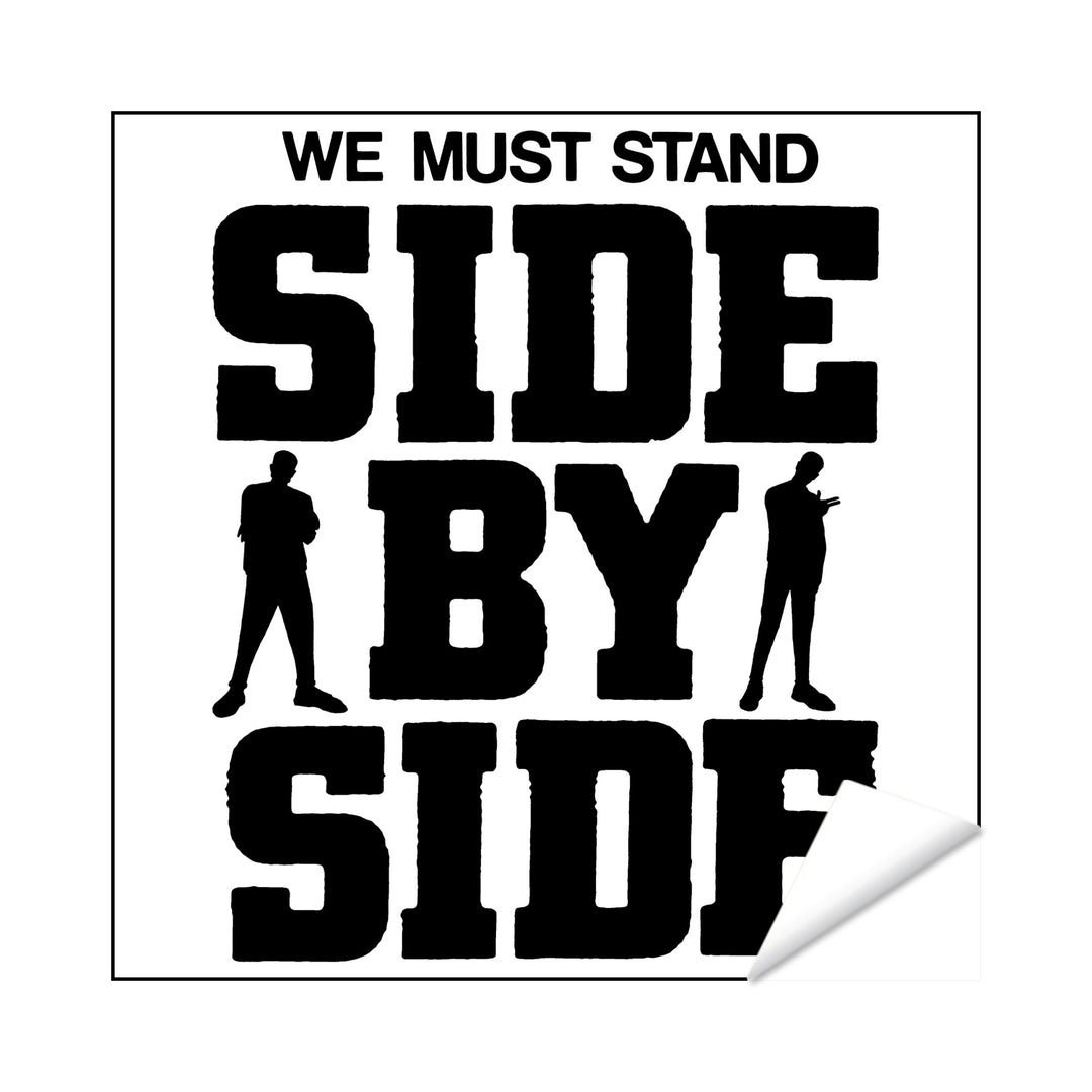 Black text on a white background reads WE MUST STAND SIDE BY SIDE with two silhouettes by BY. The MerchNow We Must Stand Sticker powerfully emphasizes unity and solidarity.