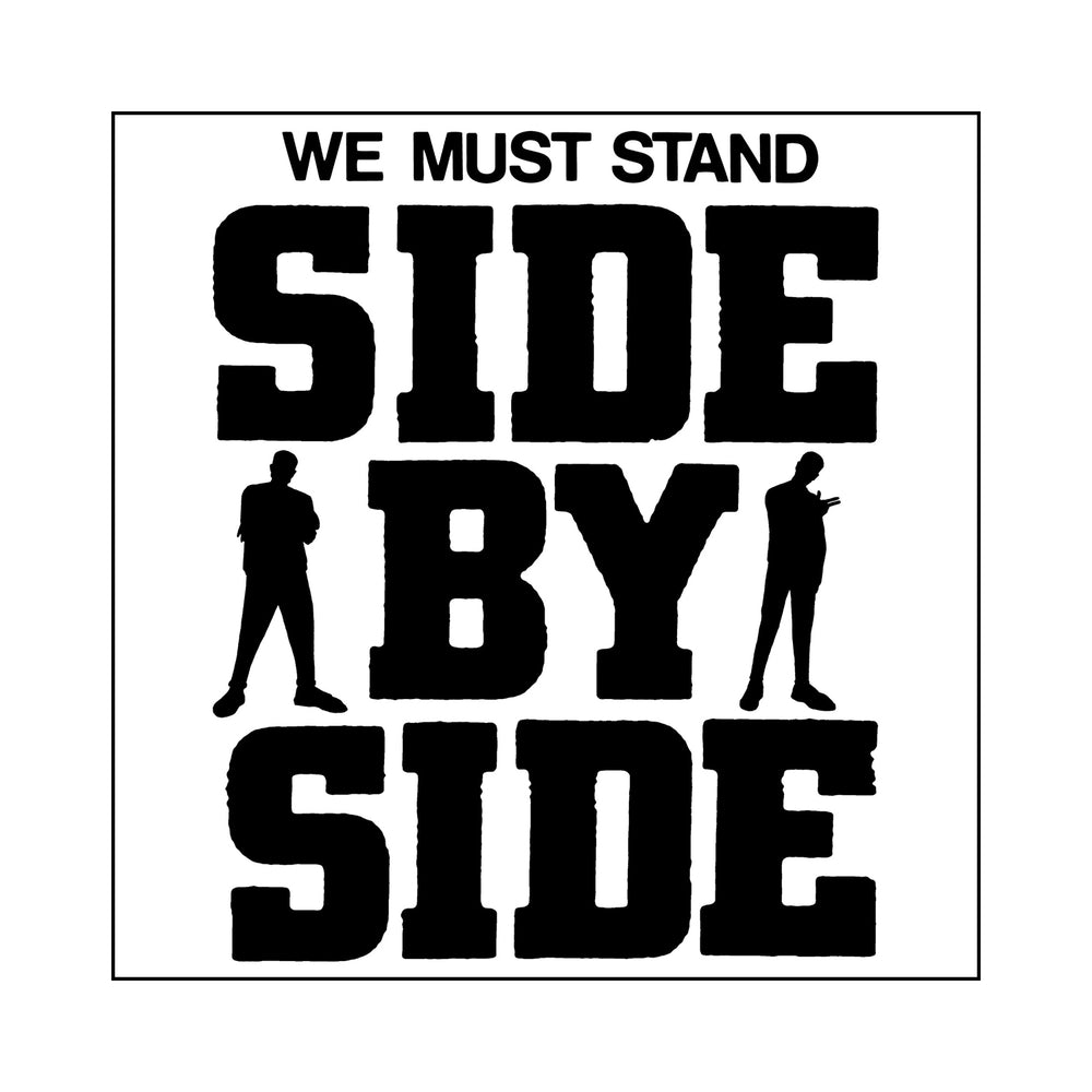 Black text on a white background reads WE MUST STAND SIDE BY SIDE with two silhouettes by BY. The MerchNow We Must Stand Sticker powerfully emphasizes unity and solidarity.