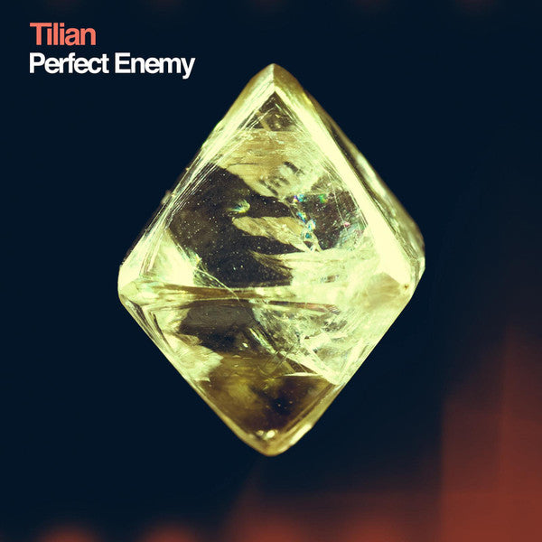 Album cover with a diamond-like crystal and 'Tilian Perfect Enemy' text on a dark background