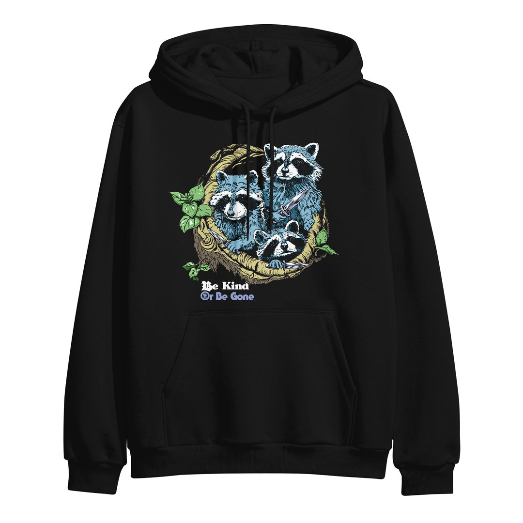 Castle Jackal black hoodie pullover featuring two raccoons nestled in a tree branch with green leaves. Be Kind Or Be Gone is printed below them in bold white and blue letters.